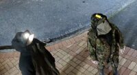 A fugitive dad who vanished into the New Zealand wilderness with his three young children has been caught on camera for the first time in a year breaking into a convenience store with one of his kids