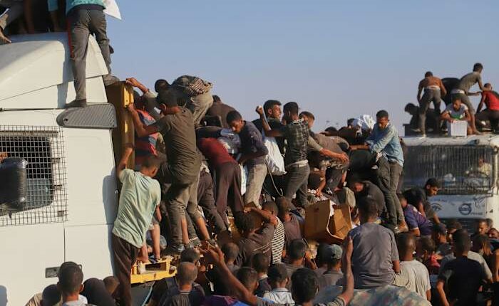 Gaza aid truck drivers face increasing danger from desperate crowds and armed gangs