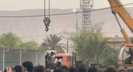 Public execution in Iran using a crane.