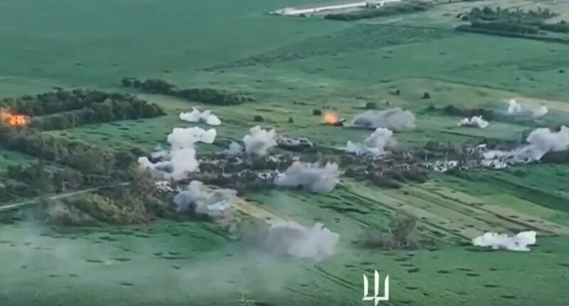 Aerial view of explosions in a field.