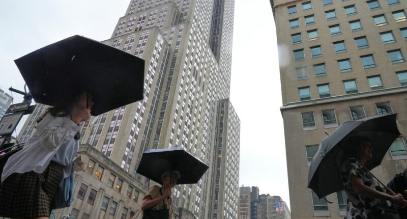 Heavy rain pummels the East Coast and sparks isolated flash flooding