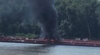 Helicopter crash on barge.