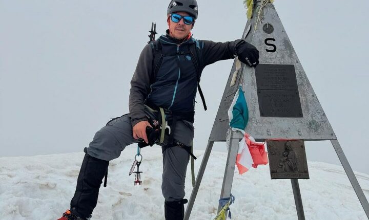Luca Sanigaglia at a mountain summit.