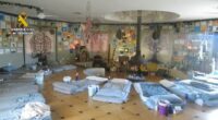 Interior of a spiritual retreat center in Spain, raided by police.  Numerous mats are arranged on the floor.