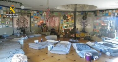 Interior of a spiritual retreat center in Spain, raided by police.  Numerous mats are arranged on the floor.