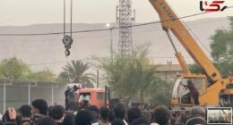 Horrifying moment Iranian 'killer' is publicly hanged from a crane