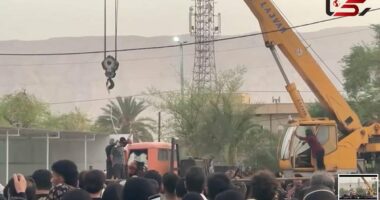 Horrifying moment Iranian 'killer' is publicly hanged from a crane