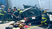 Minivan crushed in collision with tractor-trailer.