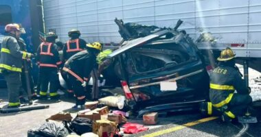 Minivan crushed in collision with tractor-trailer.