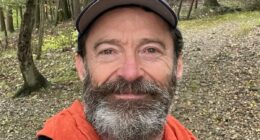 Hugh Jackman takes soothing walk in the rain following split from wife
