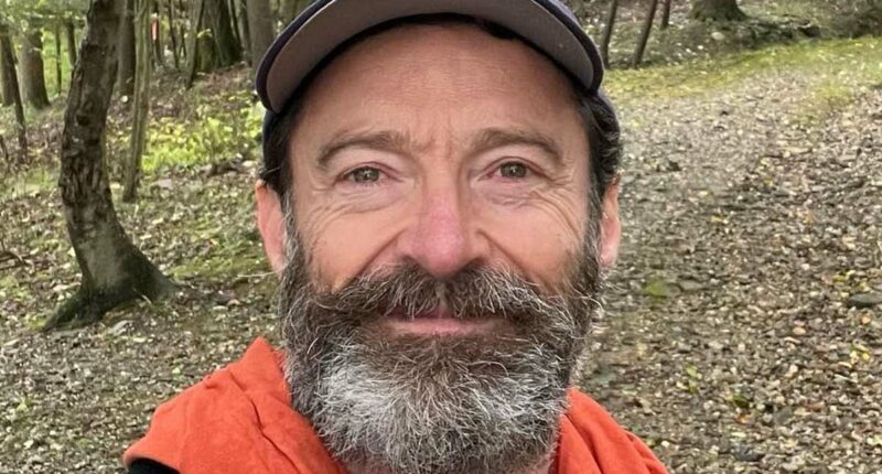 Hugh Jackman takes soothing walk in the rain following split from wife