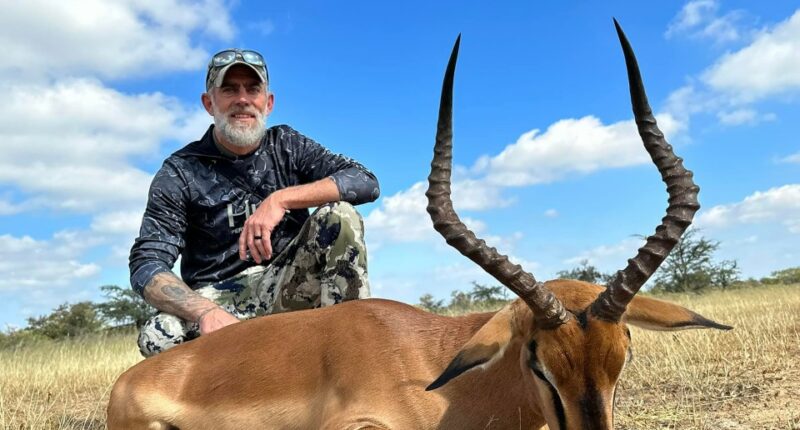 Hunter with harvested impala.