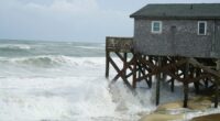 Hurricane Erin stirs up strong winds and floods part of a NC highway as it creeps up the East Coast
