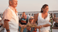 Couple exchanging vows at an outdoor wedding ceremony.