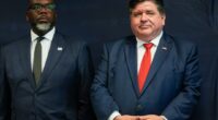 Illinois Gov. JB Pritzker, right, stands with Chicago Mayor Brandon Johnson during a Democratic National Convention security briefing at the U.S. Secret Service's Chicago Field Office Thursday, July 25, 2024, in Chicago. (AP Photo/Erin Hooley)