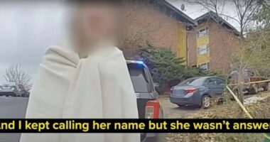 Bodycam footage of a crime scene with a blurred person wrapped in a blanket.