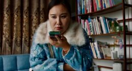 Still from the film *Mistress Dispeller*, directed by Elizabeth Lo.  A woman uses a smartphone.