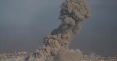 Israel declared Gaza's largest city a combat zone and recovered the remains of two hostages on Friday as the army launched the start of a planned offensive that has drawn international condemnation.