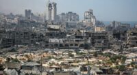Destroyed buildings and refugee tents in Gaza City.