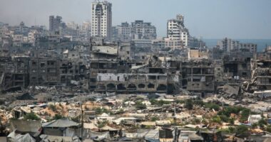 Destroyed buildings and refugee tents in Gaza City.