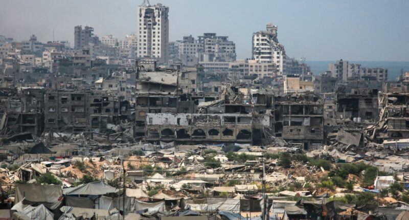 Destroyed buildings and refugee tents in Gaza City.