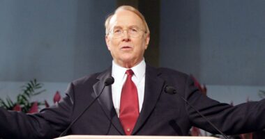 Dr. James Dobson speaking at a podium.