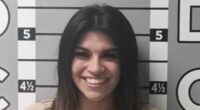 Jealous ex-girlfriend smiles in mugshot after trashing man's car