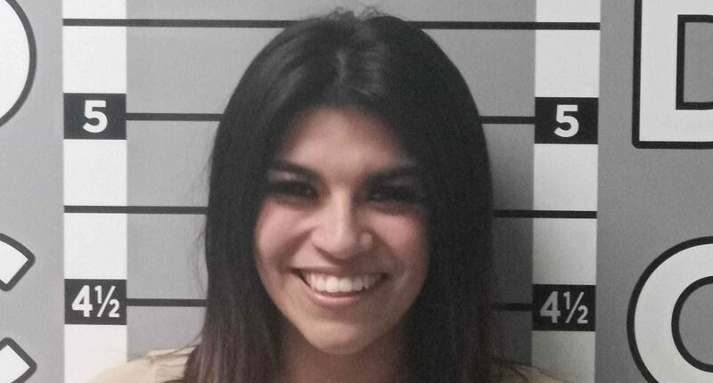 Jealous ex-girlfriend smiles in mugshot after trashing man's car