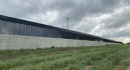 Kristi Noem Paints Border Wall a Very Special Color—at the Request of President Trump