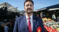 Afzal Khan, Labour's candidate, at a market.