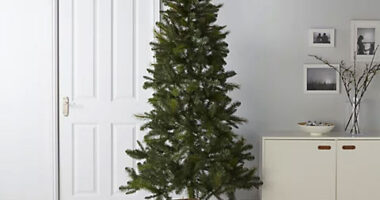 7.6ft artificial Christmas tree surrounded by presents.
