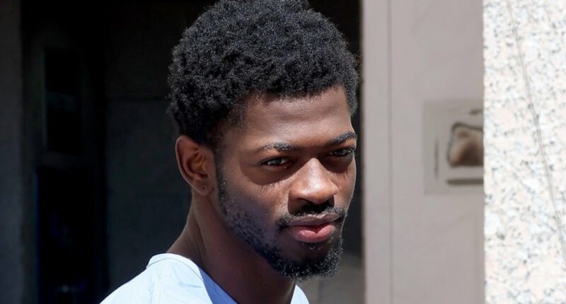 Lil Nas X wears blue prison jumpsuit while leaving LA court