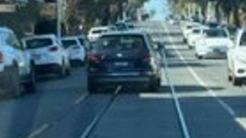 Man throws hammer at woman's car in road rage incident in Melbourne
