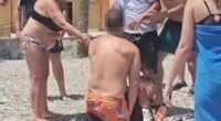 Migrants detained on Spanish beach after being tackled by tourists