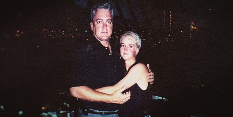 Photo of Amy Bradley and a man embracing.