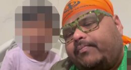 Moment accused killer parades his kids for the camera