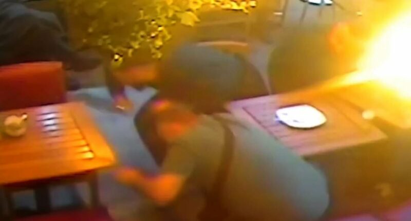 Moment gunman fires bullets into restaurant as rival gang run