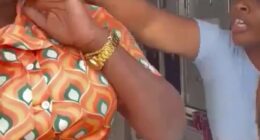 A flight attendant being assaulted by a passenger.