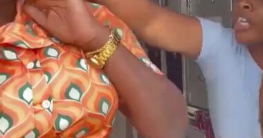 A flight attendant being assaulted by a passenger.