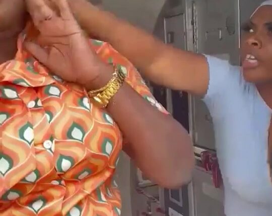 A flight attendant being assaulted by a passenger.
