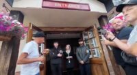 Moment pub-goers wearing flag turned away for refusing to take it off