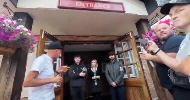 Moment pub-goers wearing flag turned away for refusing to take it off