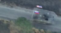 Captured US M113 APC with Russian and US flags.