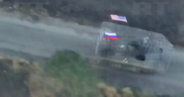 Captured US M113 APC with Russian and US flags.