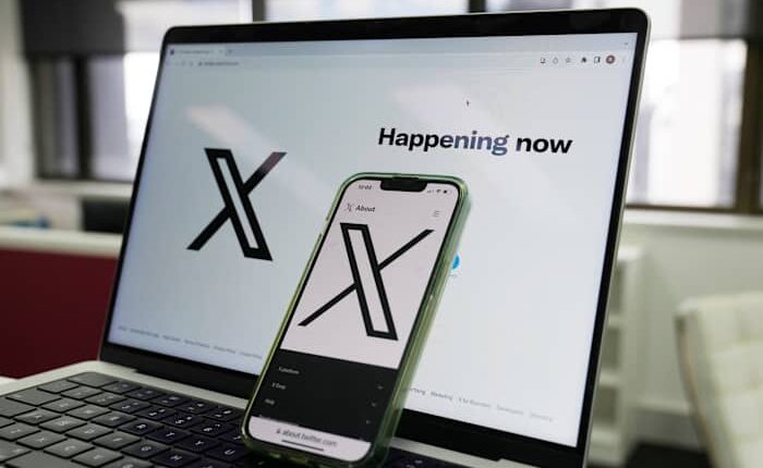 Musk says he plans to sue Apple for not featuring X or Grok among its top apps