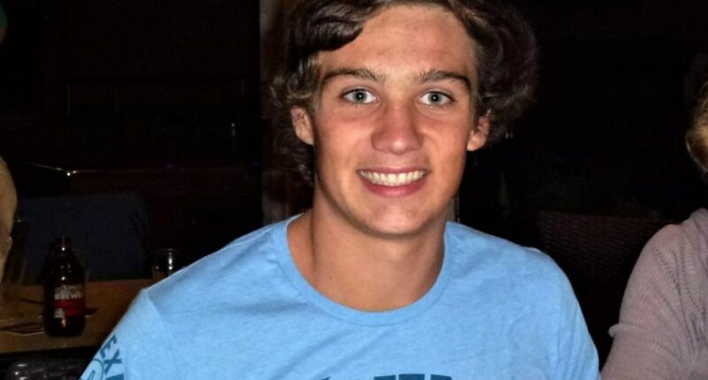 Photo of a smiling teenage boy.