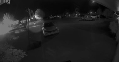 Neighbor's camera captures moment deputy's vehicles set on fire