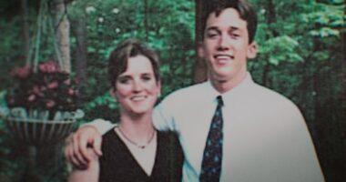 Photo of a young couple posing outdoors.