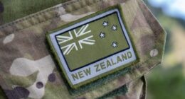 A soldier wears a New Zealand army emblem on exercise in the Nausori Highlands in Fiji, Sept. 9, 2022. (Petty Officer Chris Weissenborn/NZ Defence via AP)