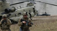 Soldiers and helicopters during a NATO military exercise.
